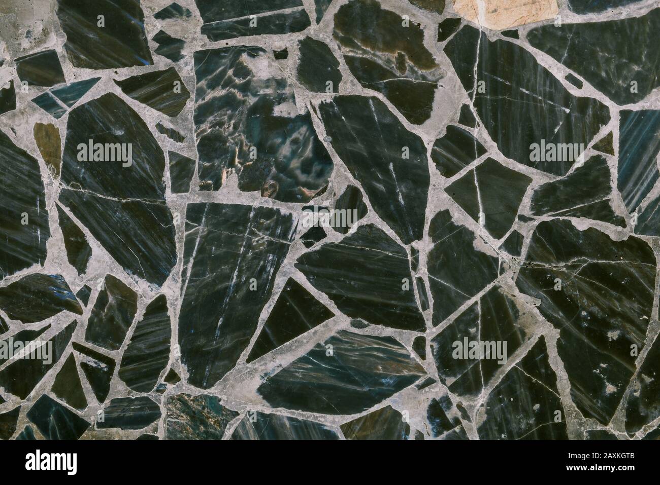 Tiles on the wall or floor in marble. Marble texture with a pattern. Abstract dark background. Stock Photo