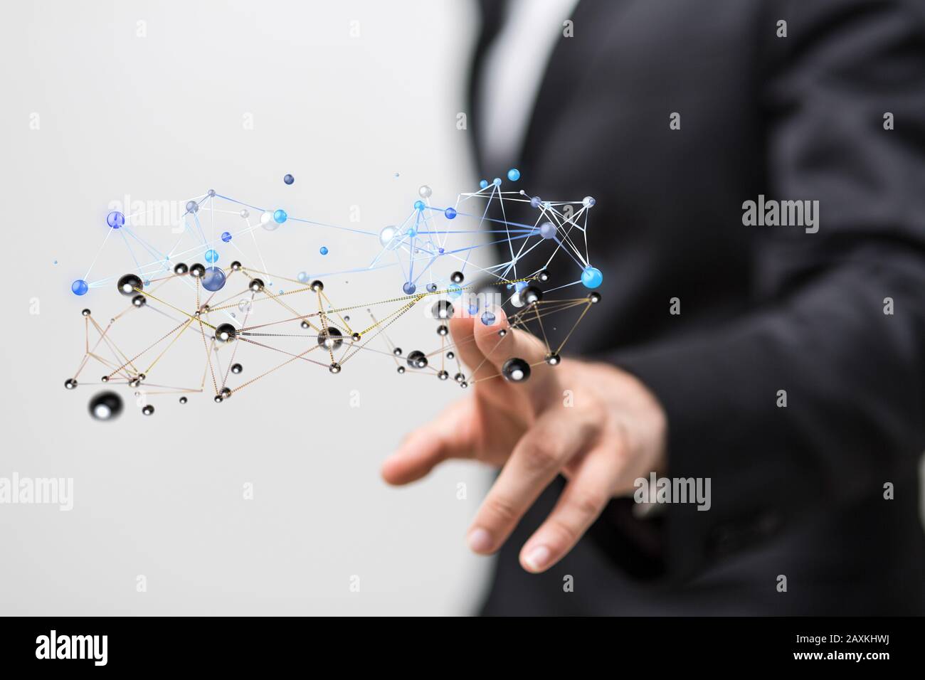 Businessman working with a virtual projection of computing cloud Stock Photo