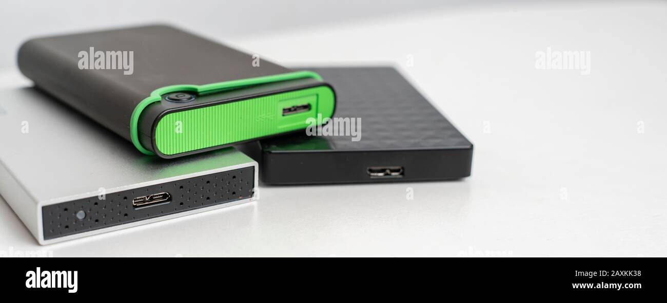 the three external hdd drives one the shelf, data backup storage Stock Photo