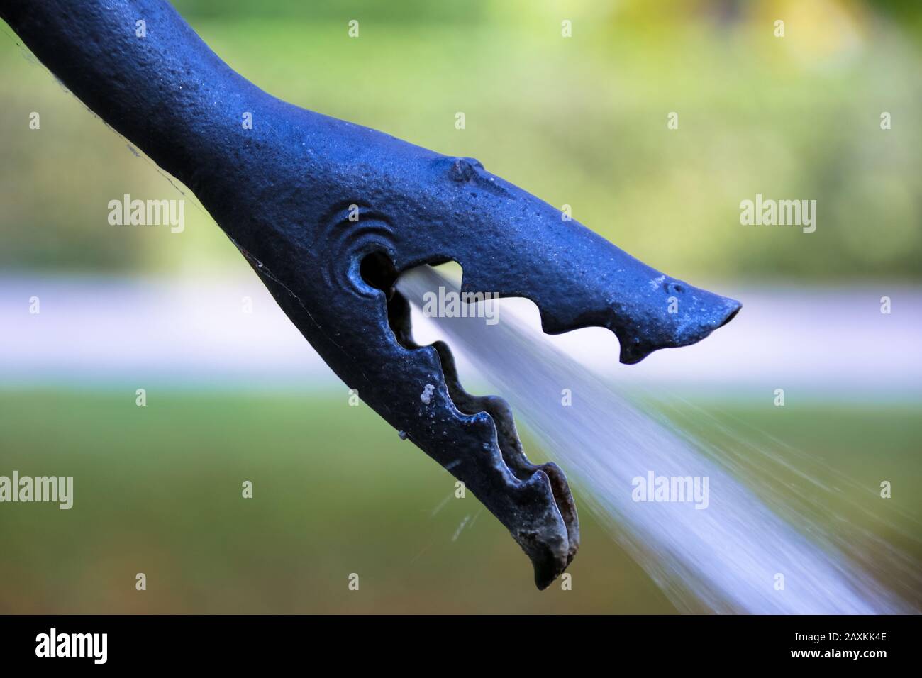 Close-Up Of Water Spraying From Faucet Stock Photo