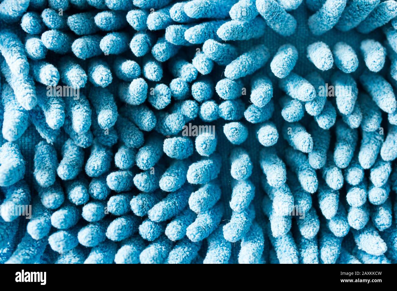 A macro photography of a blue mop under the lights Stock Photo - Alamy