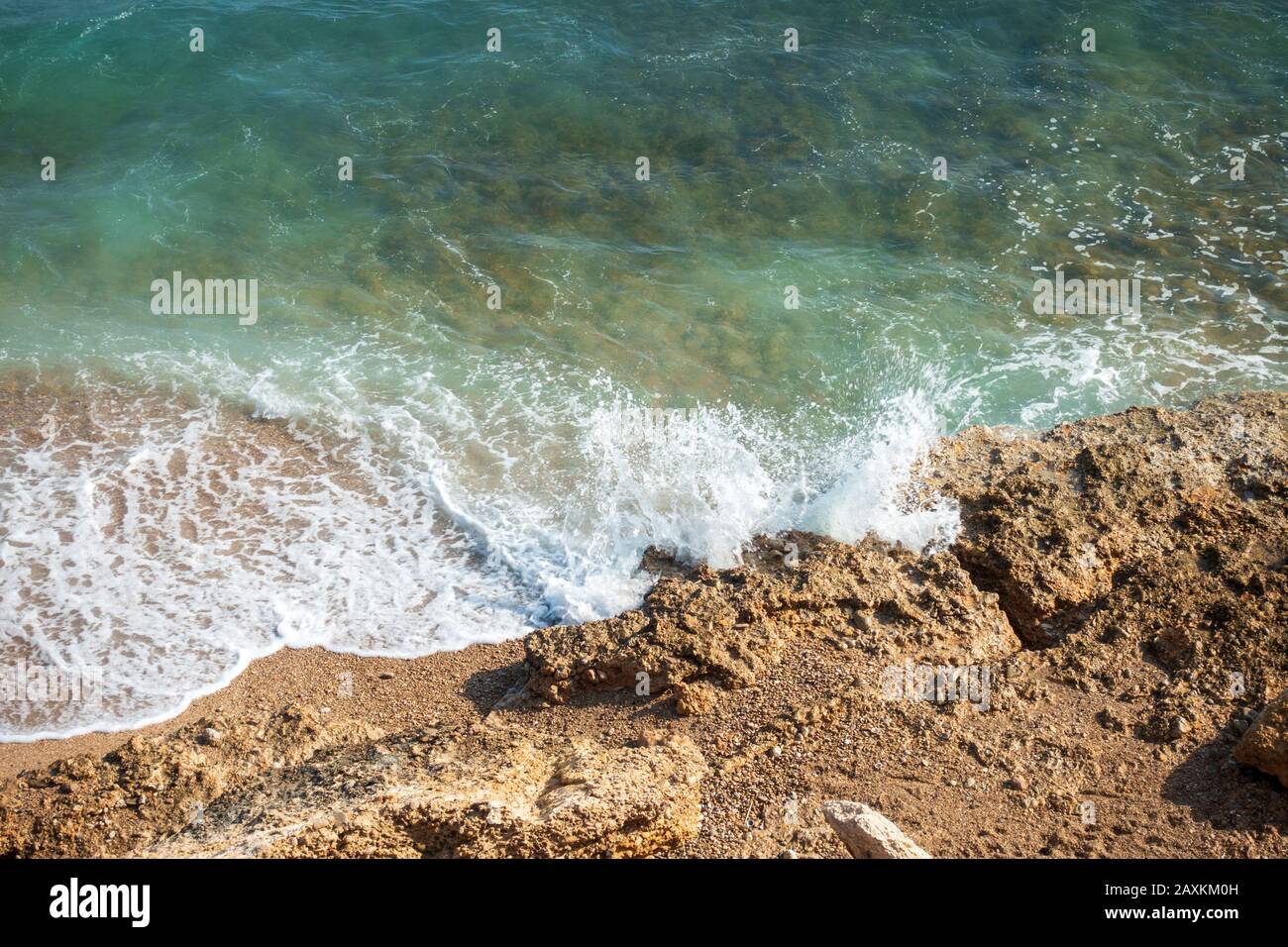 Waves reaching sea shore sunny hi-res stock photography and images - Alamy
