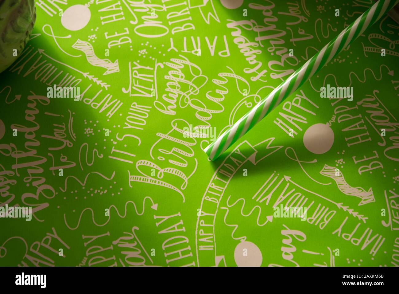 Green straw on green background with lettering happy birthday Stock Photo