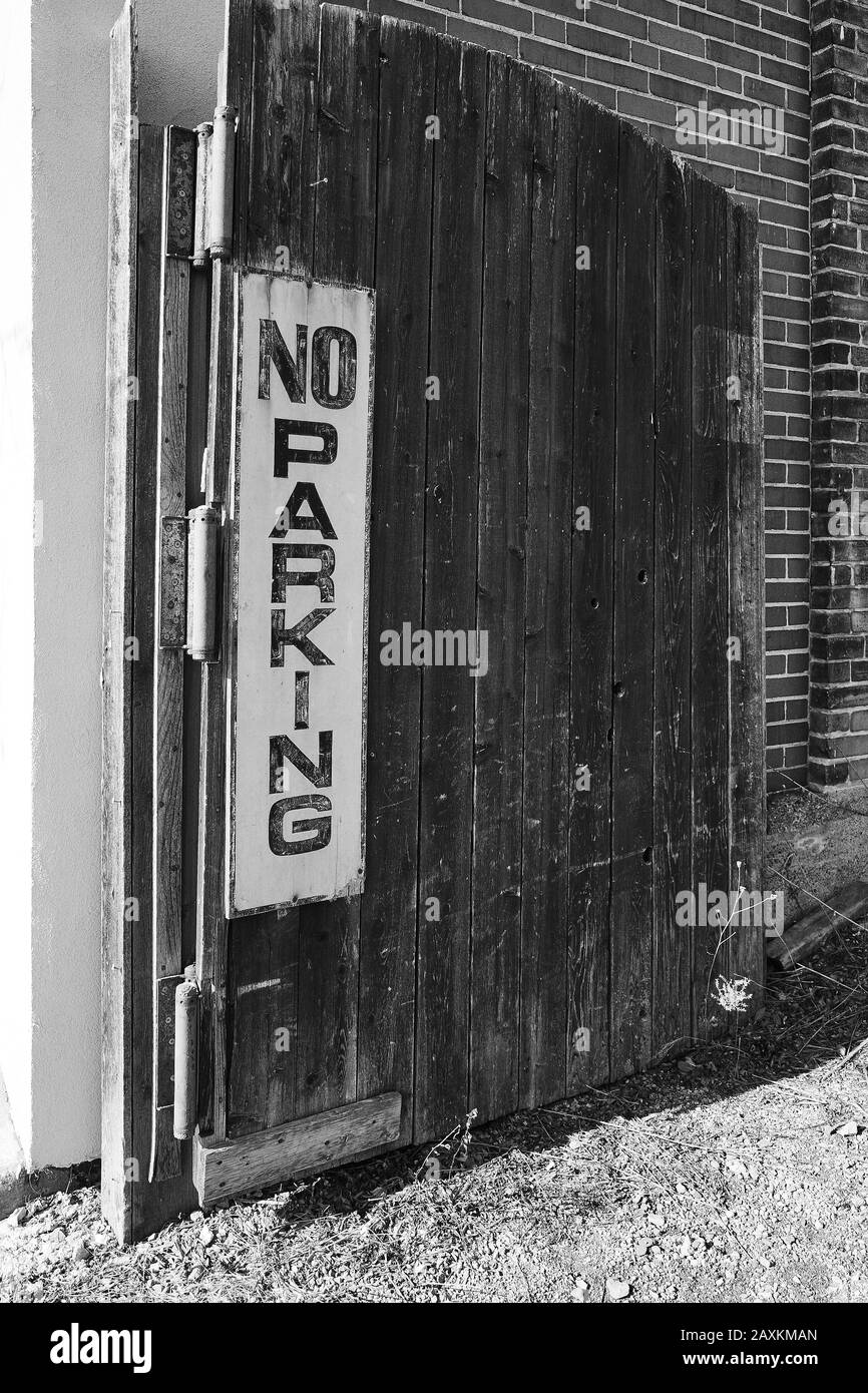 No parking sign on gate Black and White Stock Photos & Images - Alamy