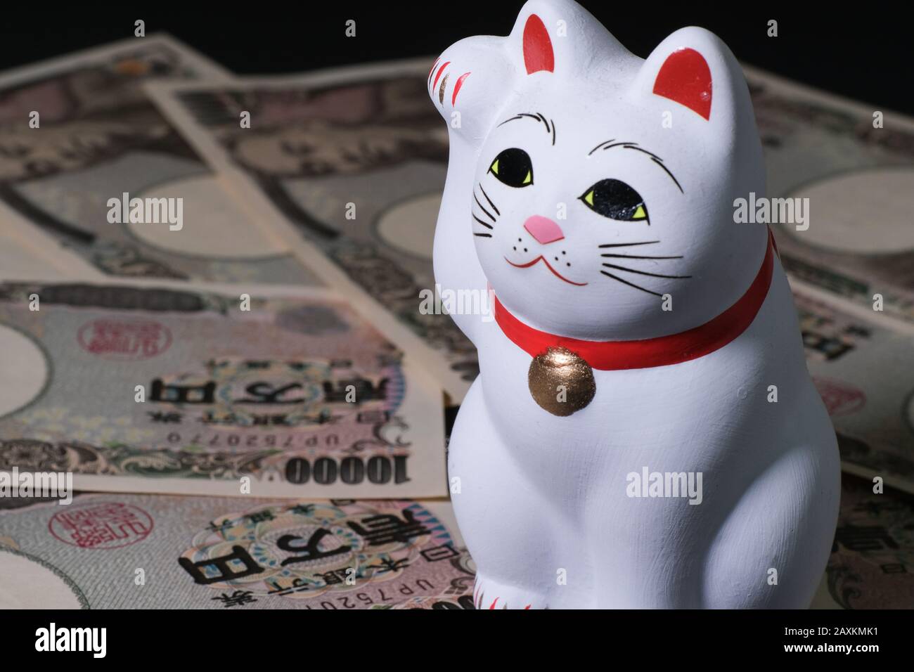Closeup shot of a Japanese lucky cat Maneki neko on Japanese
