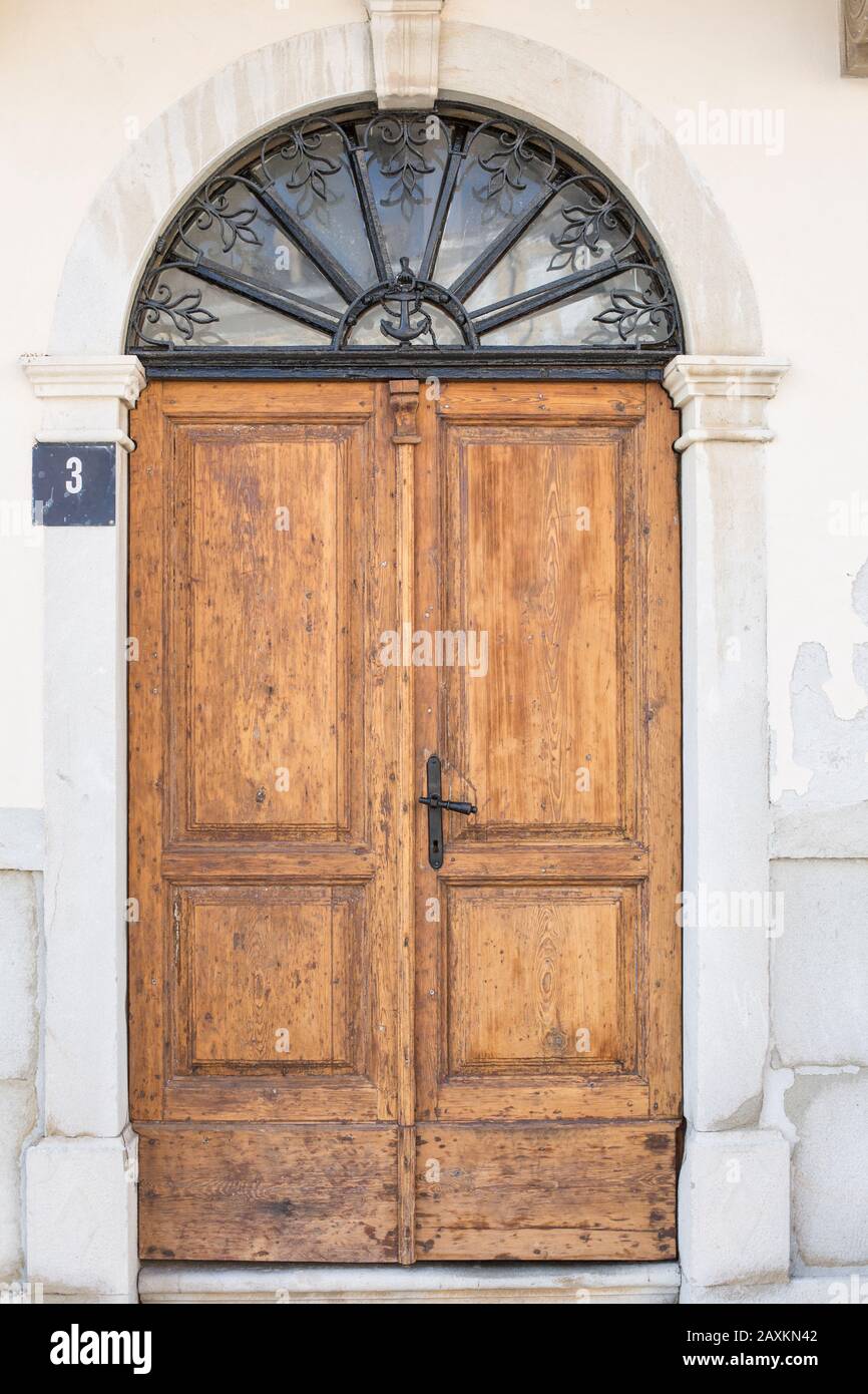 Old wooden door in Cres, Croatia Stock Photo