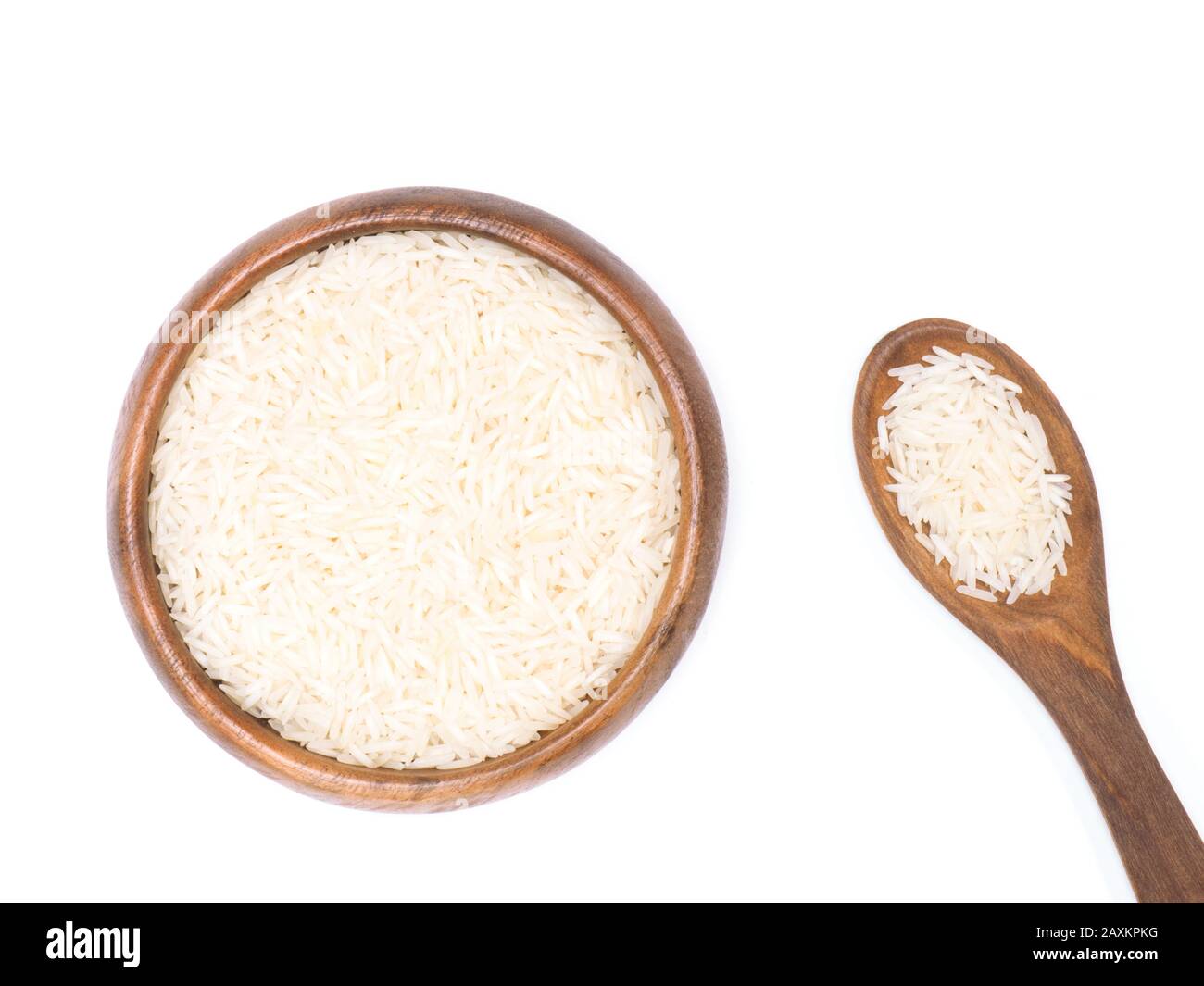 Indian long grain Basmati rice in brown wooden bowl and spoon isolated on white. Indian cuisine