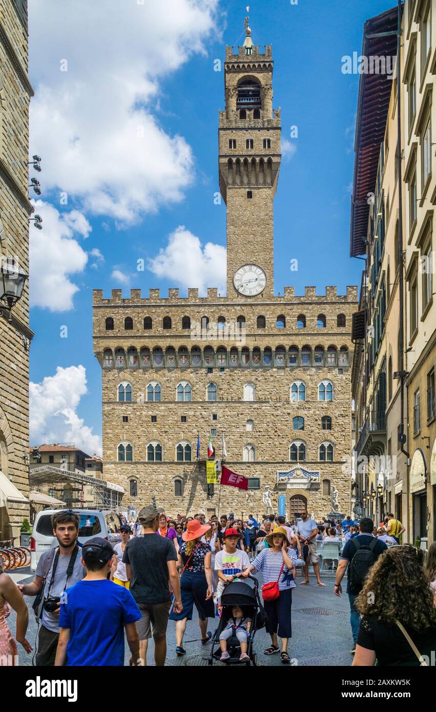 Palazzo Vecchio with imposing Torre d'Arnolfo and Piazza della Signoria in the very heart of midieval Florence, Tuscany, Italy Stock Photo