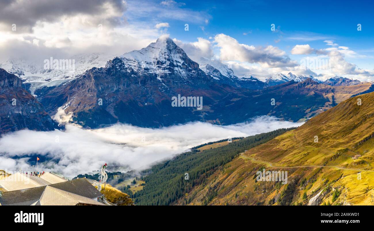 People admiring the autumn landscape from elevated walkway (Cliff Walk by Tissot), First, Grindelwald, Canton of Bern, Switzerland Stock Photo