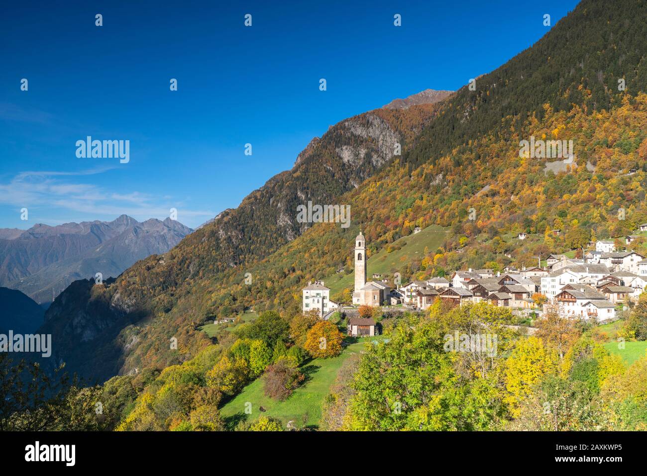 Village of Soglio surrounded by colorful woods during autumn, Val Bregaglia, canton of Graubunden, Switzerland Stock Photo