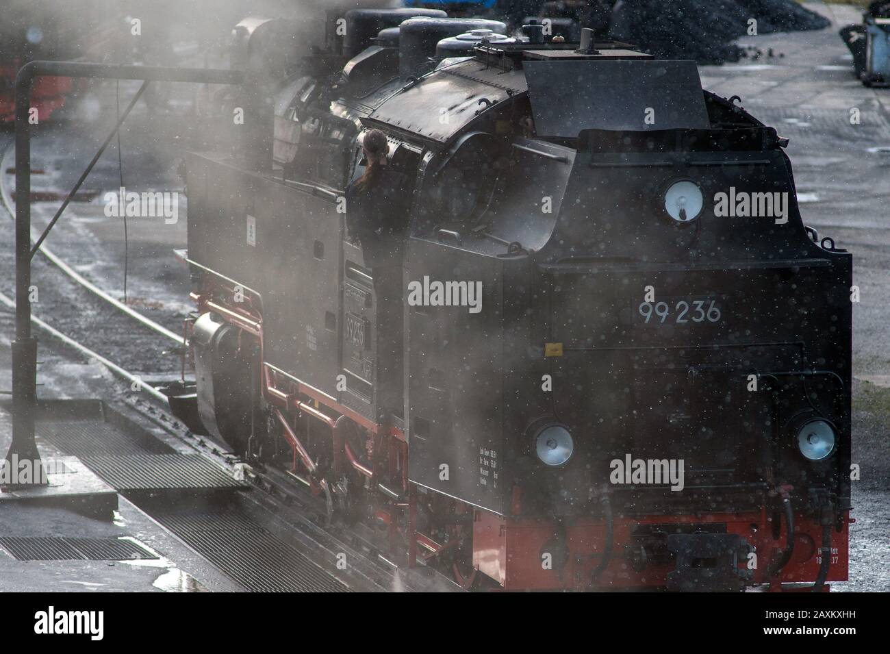 Wernigerode, Germany. 12th Feb, 2020. A steam locomotive of the Harzer Schmalspurbahnen (HSB) returns to the locomotive shed at Wernigerode station in the early afternoon with light snowfall. The clean-up work on the railway company's tracks had not yet been fully completed by the afternoon. The trains from Wernigerode only went as far as Drei Annen Hohne. Credit: Klaus-Dietmar Gabbert/dpa-Zentralbild/ZB/dpa/Alamy Live News Stock Photo