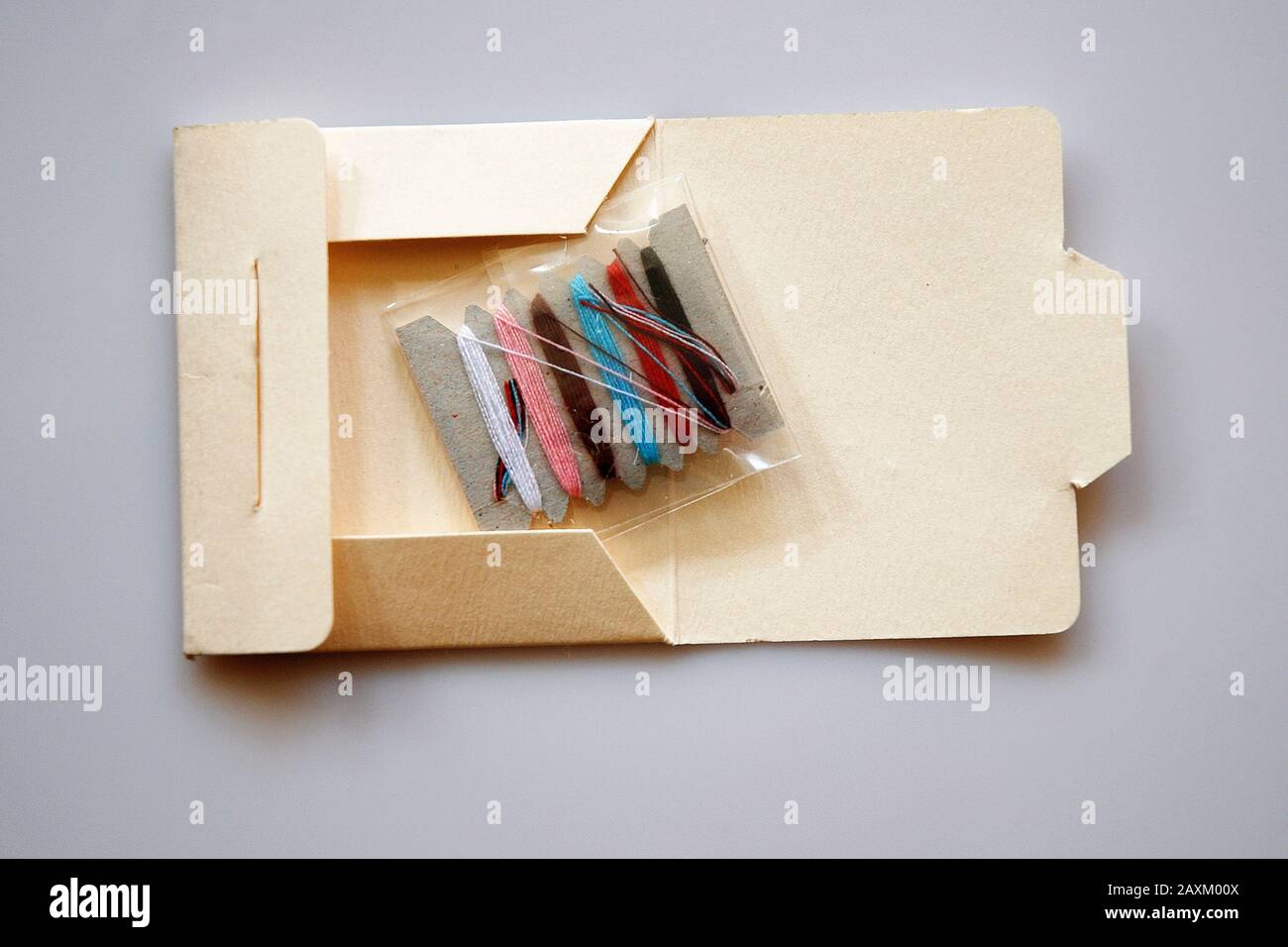 Sewing kit isolated on grey background Stock Photo