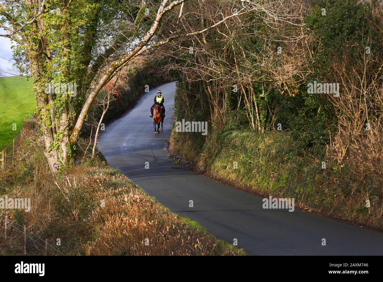 Horse rider on country lane hi-res stock photography and images - Alamy