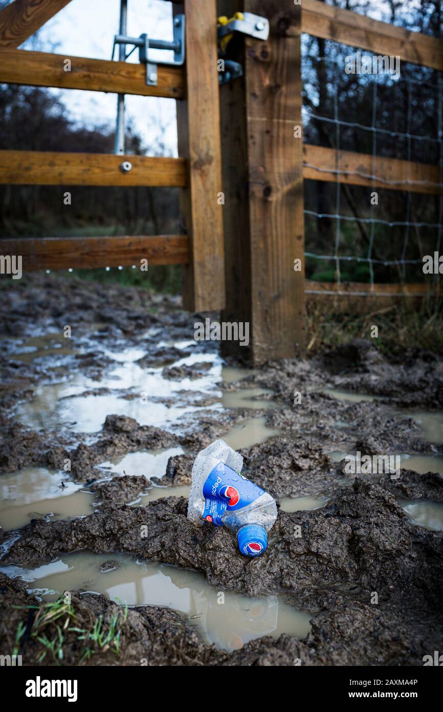 Plastic soft drink bottle discarded on a footpath in the Forest of Dean, Gloucestershire. Stock Photo