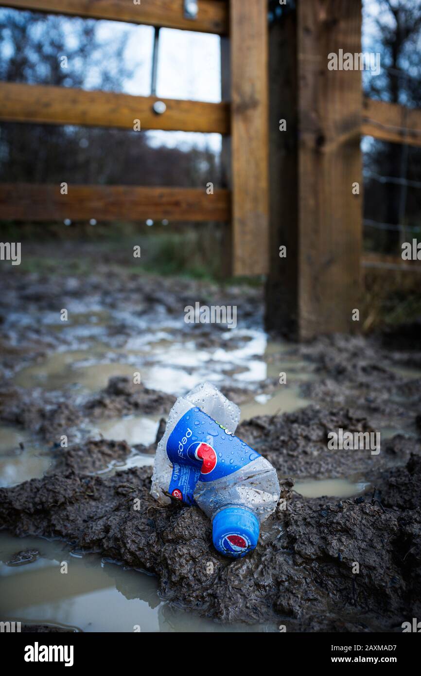 Plastic soft drink bottle discarded on a footpath in the Forest of Dean, Gloucestershire. Stock Photo