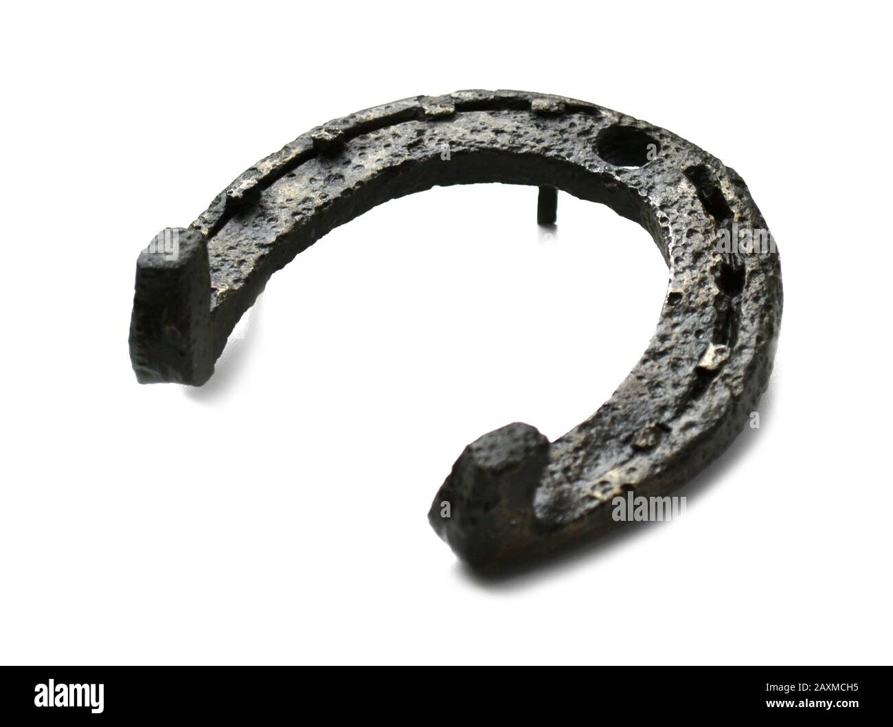 historical and ancient metal horseshoe on a white background Stock