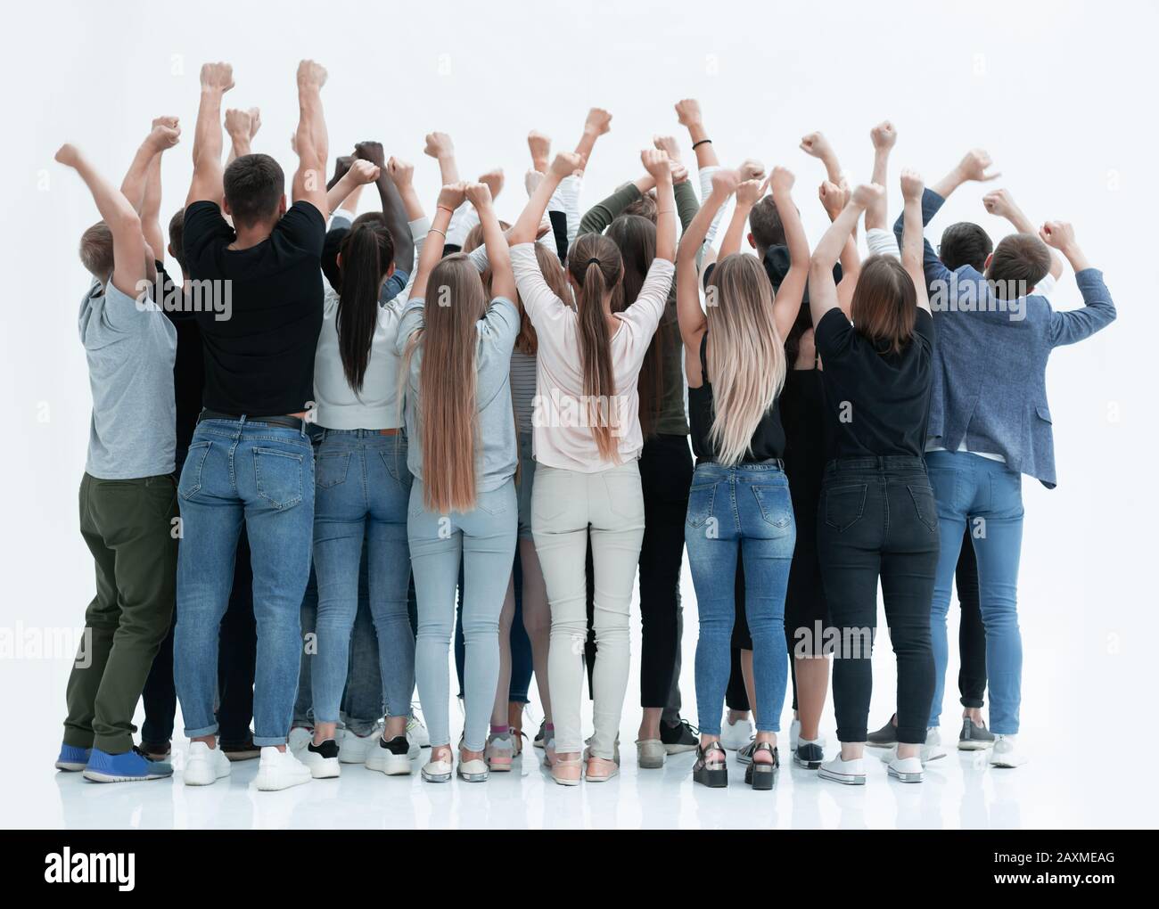 team of happy young people standing with hands up Stock Photo - Alamy