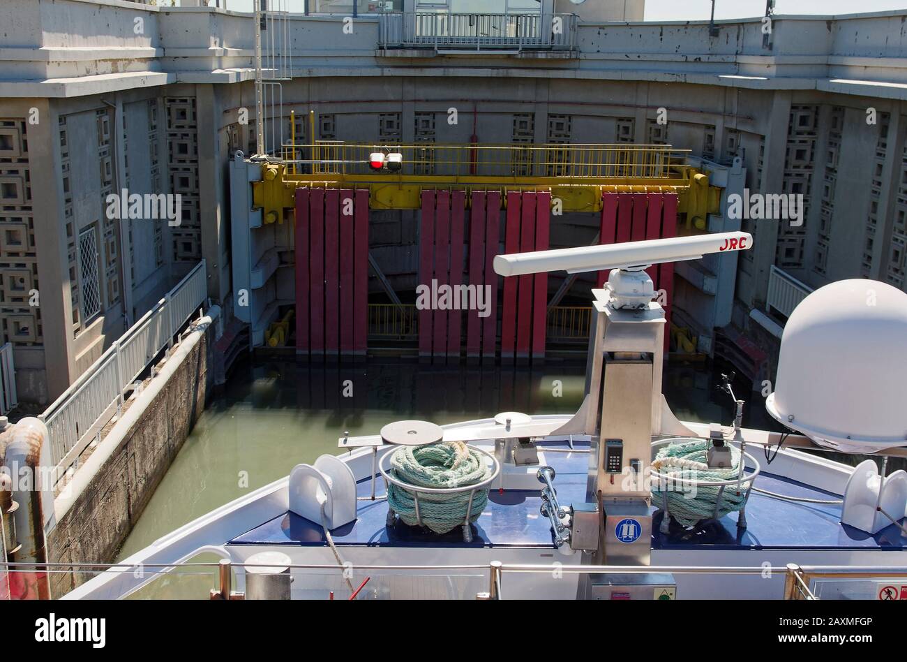 riverboat in Bollene Lock, Rhone River, 71 foot water level difference, navigable, waterway technology, marine, Provence, France, summer, horizontal Stock Photo