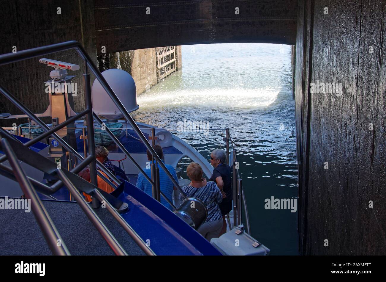 Bollene Lock, door opening, riverboat, people, Rhone River, 71 foot water level difference, navigable, waterway technology, marine, Provence, France, Stock Photo
