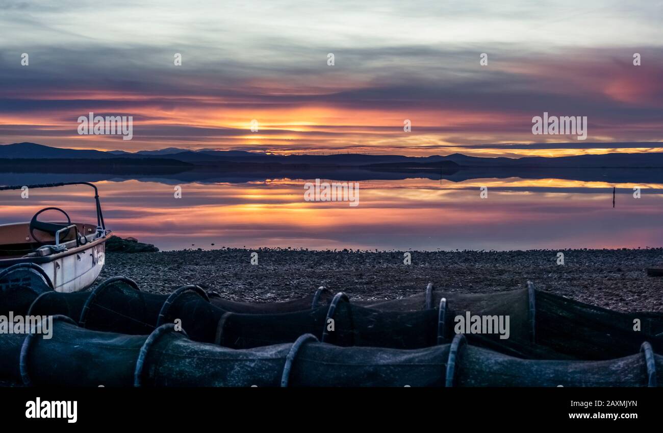 Sundown with the Ètang de l'Ayrolle in the fishing village close to Gruissan in autumn. Stock Photo