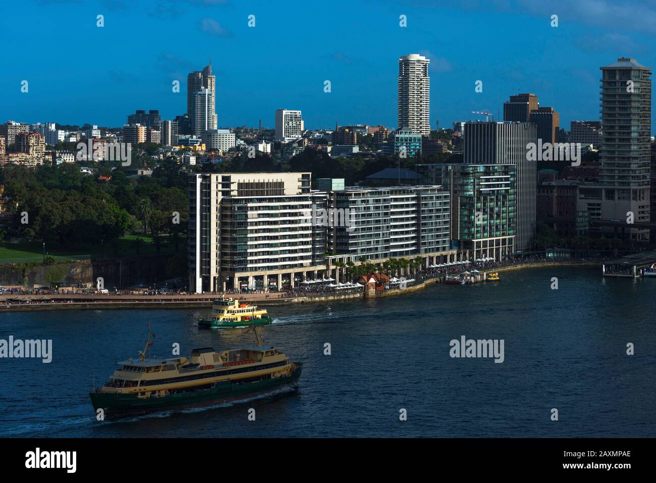 Aerial view of Ferries on their approach to Circular quay with Bennelong Apartments aka The Toasters. Sydney city centre, New South Wales Australia. Stock Photo