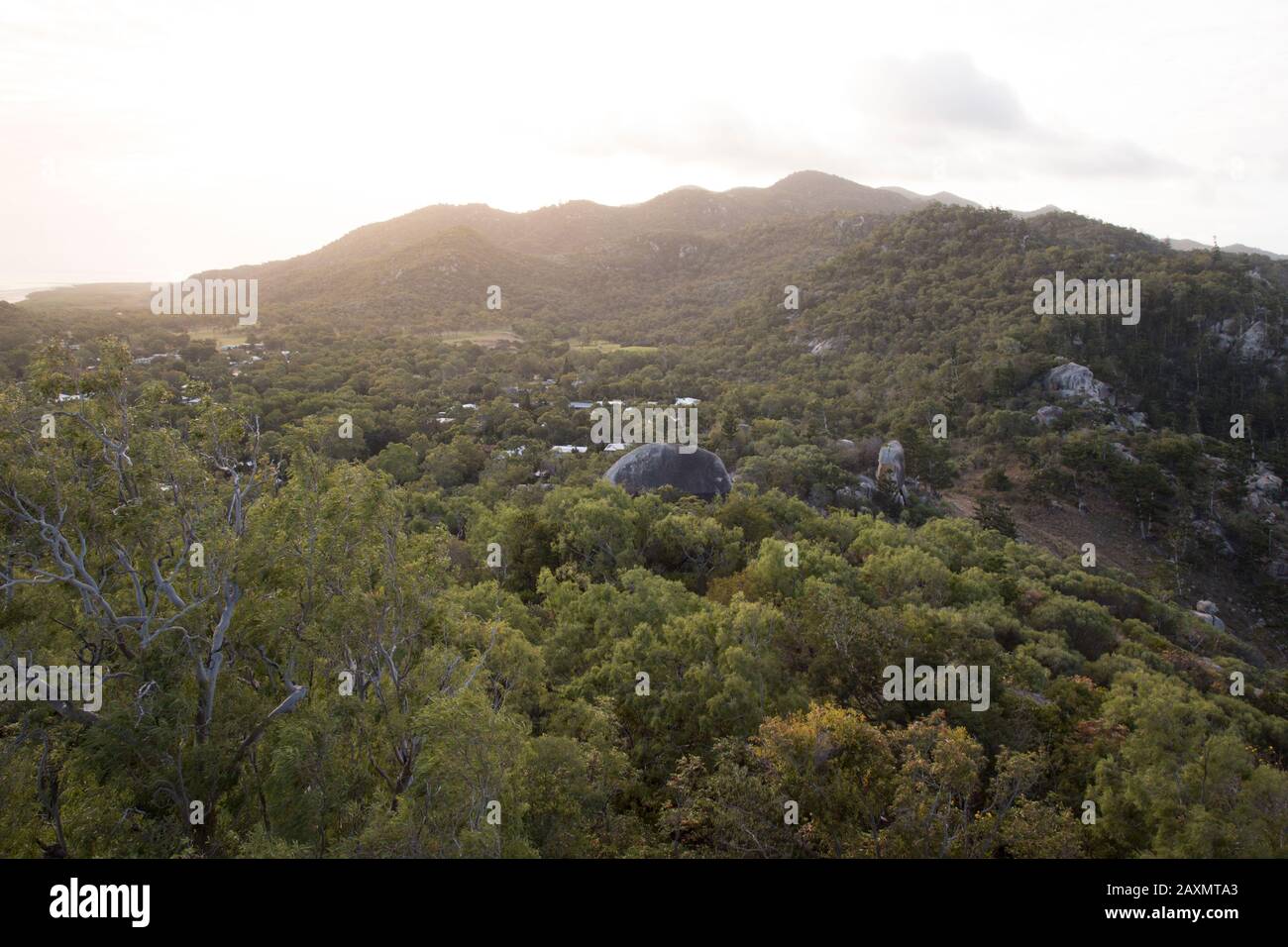 Golden sunset in the green exotic mountains of Magnetic Island, QLD Stock Photo