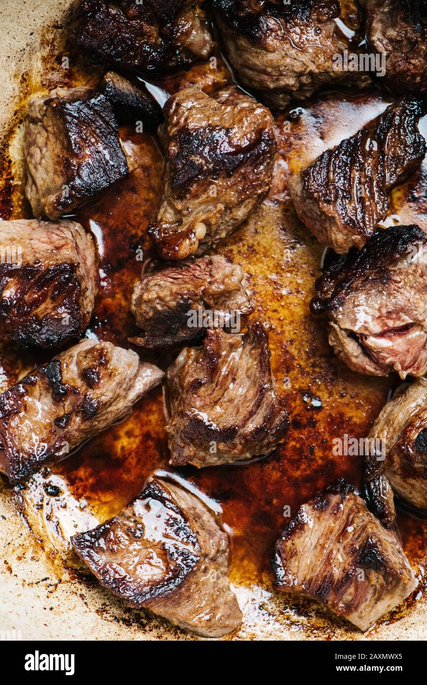 Browned stew meat with juices in a Dutch oven Stock Photo