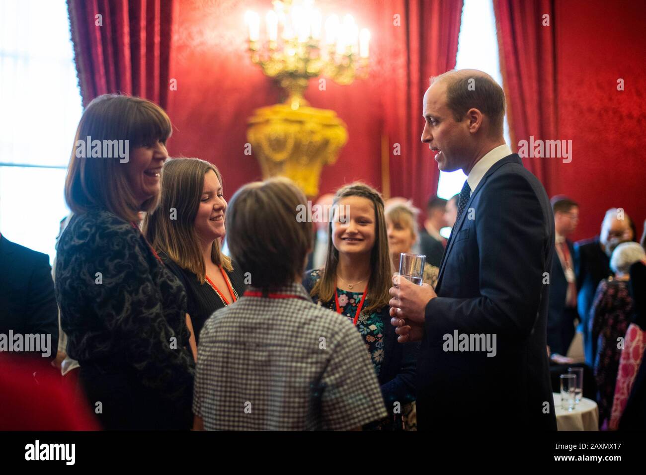 The Duke of Cambridge talks with guests during a Metropolitan and City Police Orphans Fund reception at St James's Palace, London, to mark the 150th anniversary of the Fund. PA Photo. Picture date: Wednesday February 12, 2020. See PA story ROYAL William. Photo credit should read: Victoria Jones/PA Wire Stock Photo