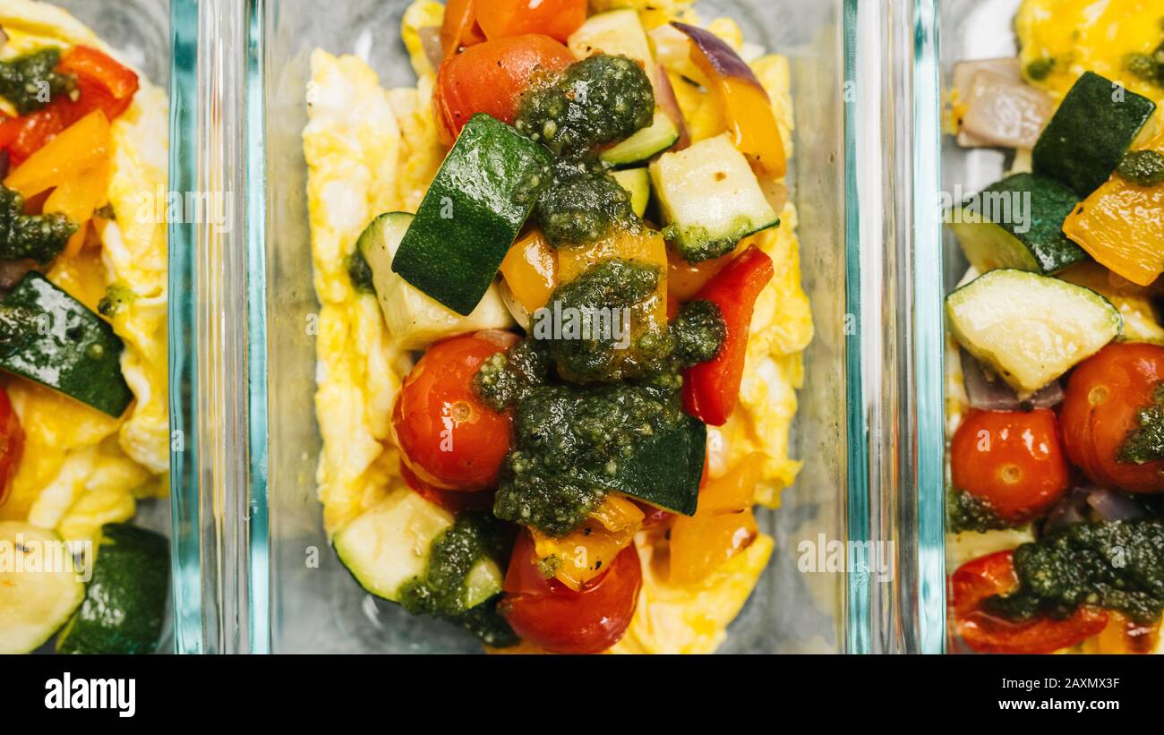 Whole30 vegetable scramble meal prep containers Stock Photo