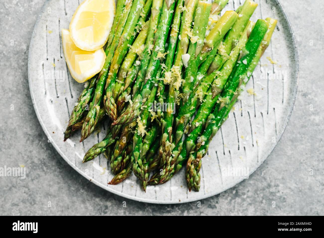 Platter of lemon garlic asparagus Stock Photo