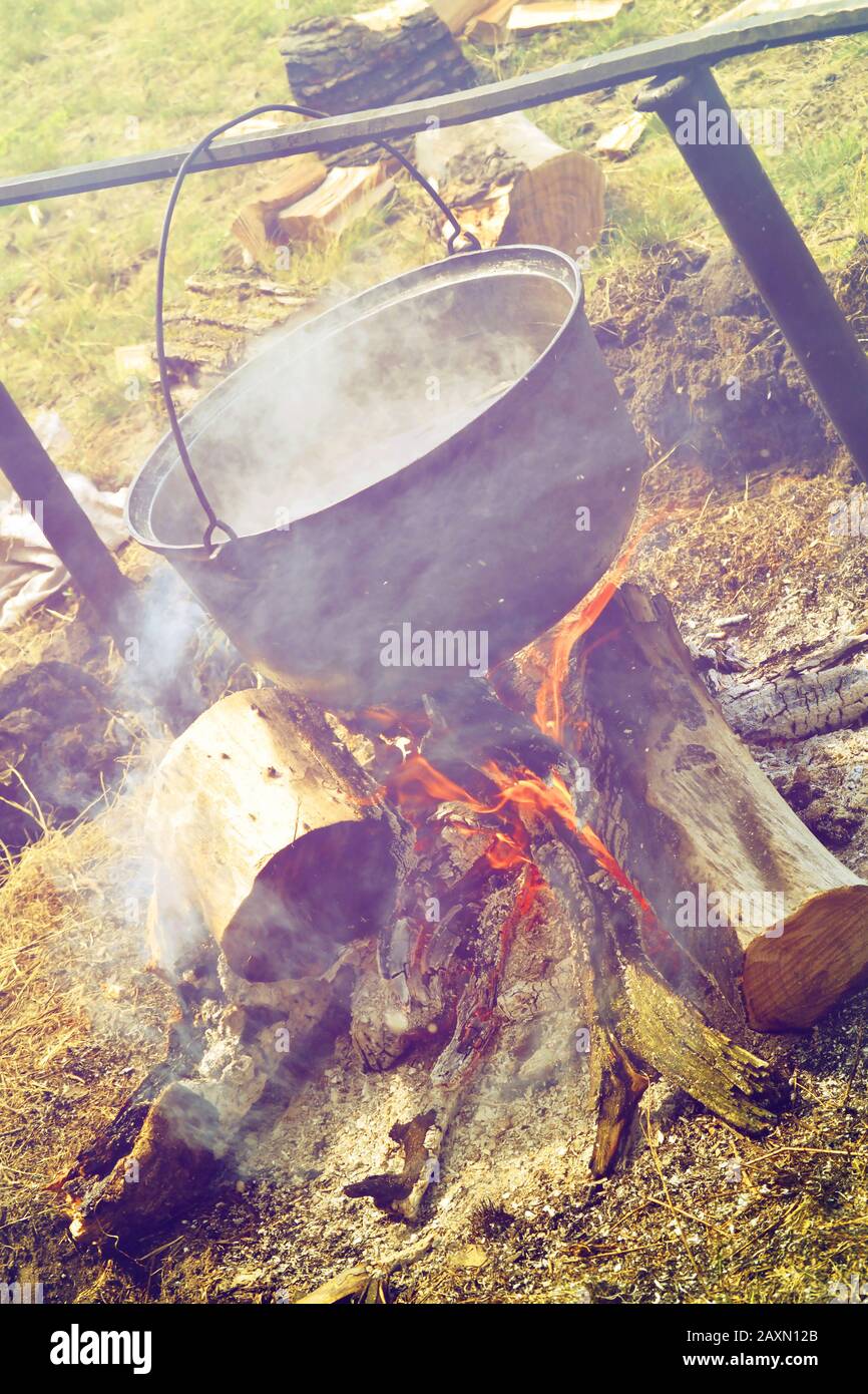 Pot hanging over camp fire hi-res stock photography and images - Alamy