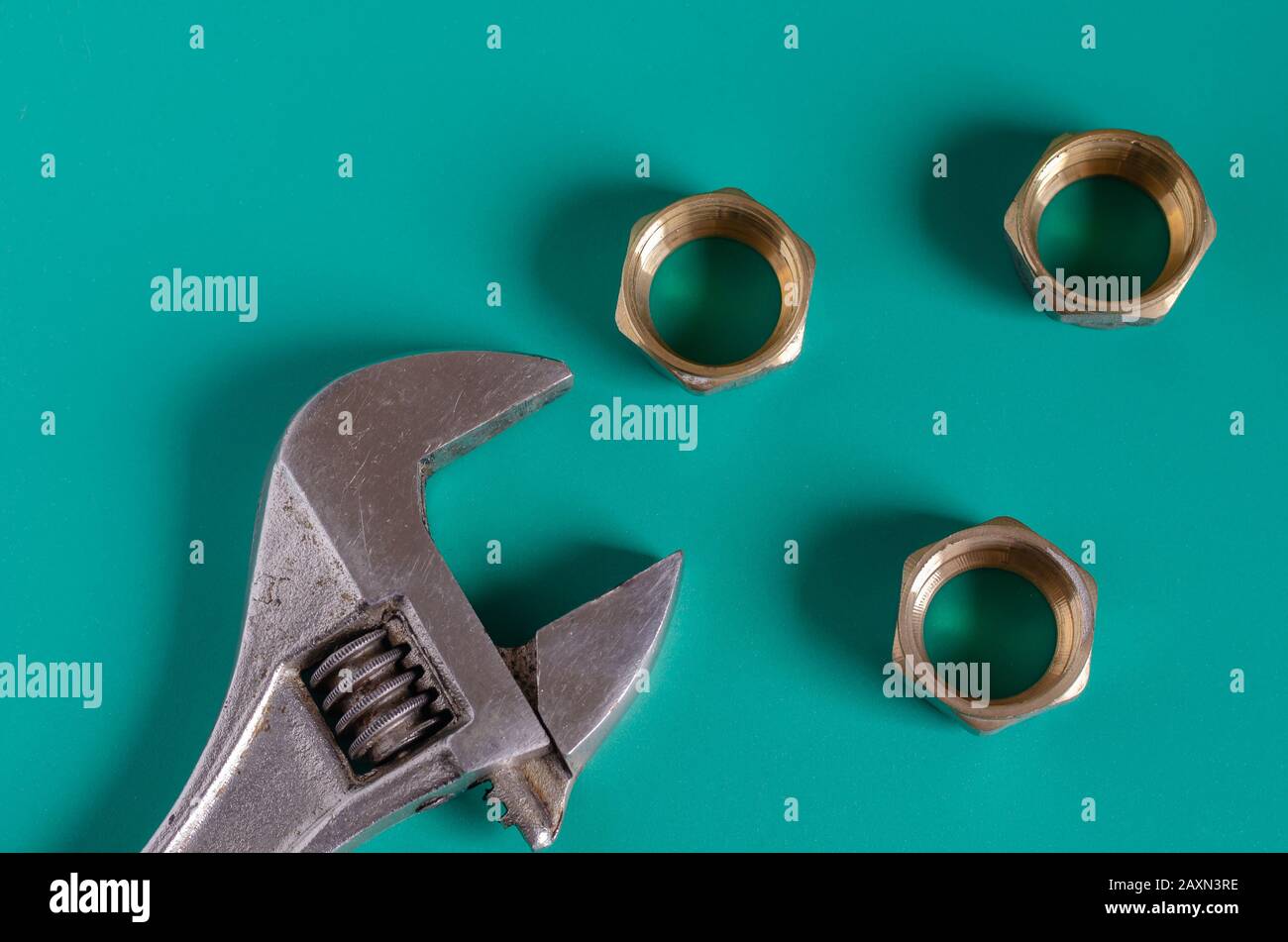 Brass nuts for pipe compression fittings. Close-up. Selective focus ...