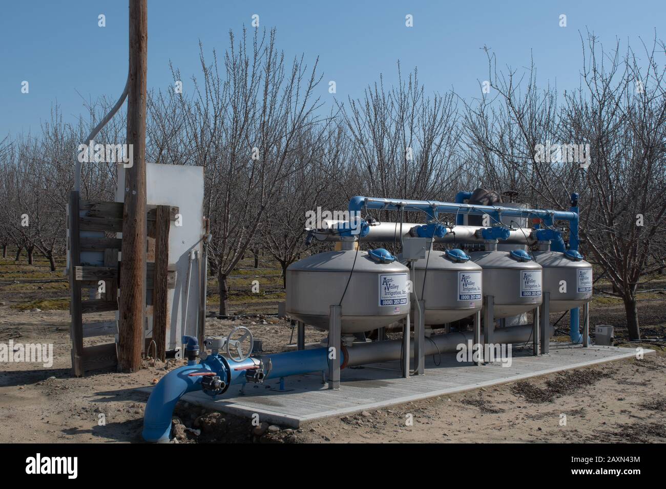 Nurse tanks for adding fertilizers to irrigation system in a California nut orchard Stock Photo