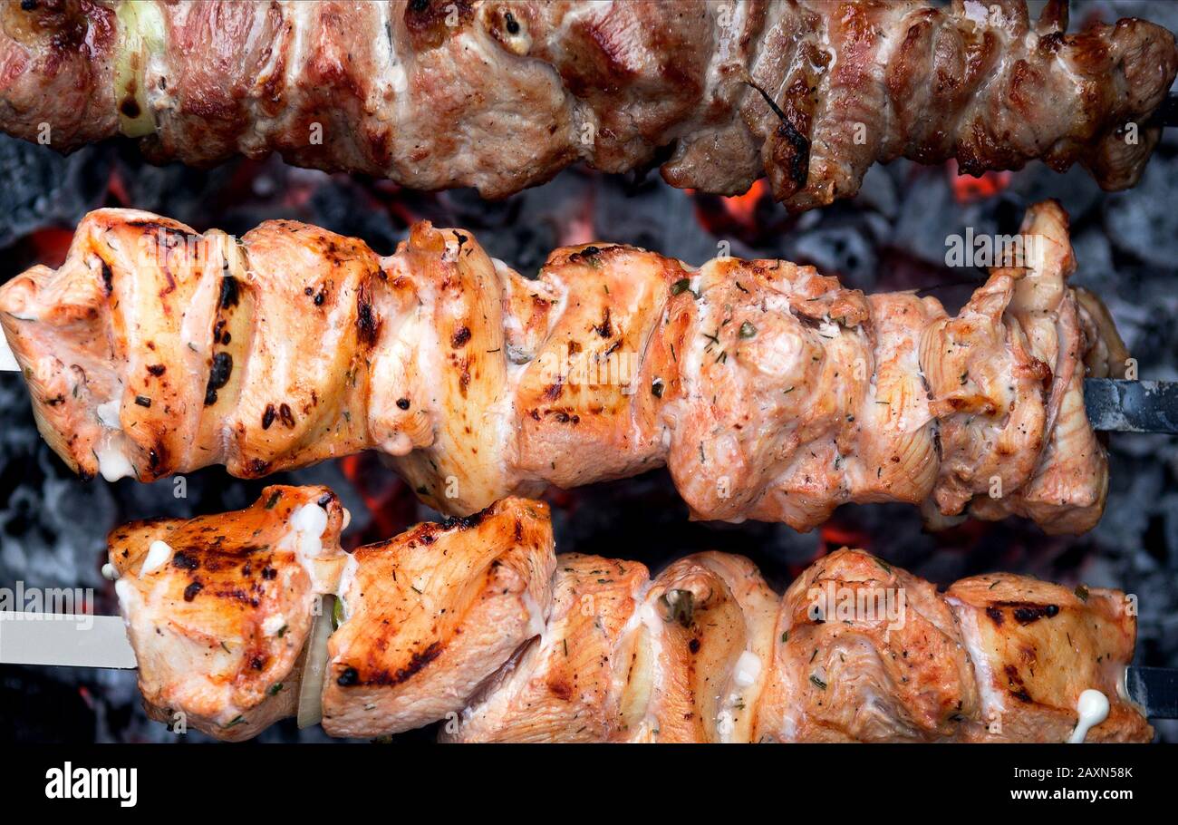 Barbecue Grill. Beef andd pork Shish kebab on skewers fried on hot coals. Closeup  of meat skewers. Barbecue skewers meat kebabs. Stock Photo