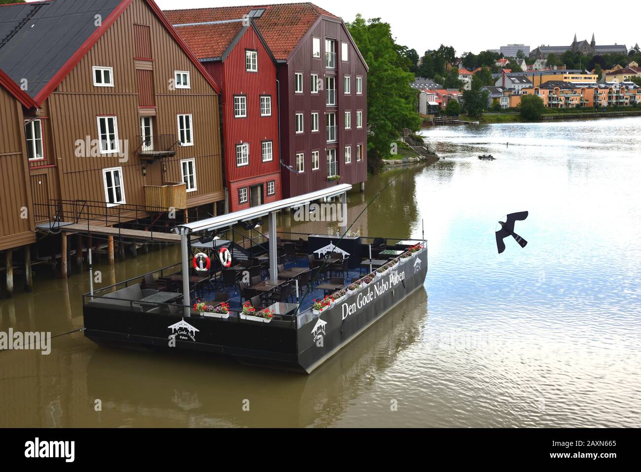 Den Gode Nabo Puben, or The Good Neighbour Pub, is situated on the Nidelva River in the Bakklandet district of Trondheim, Norway. Stock Photo