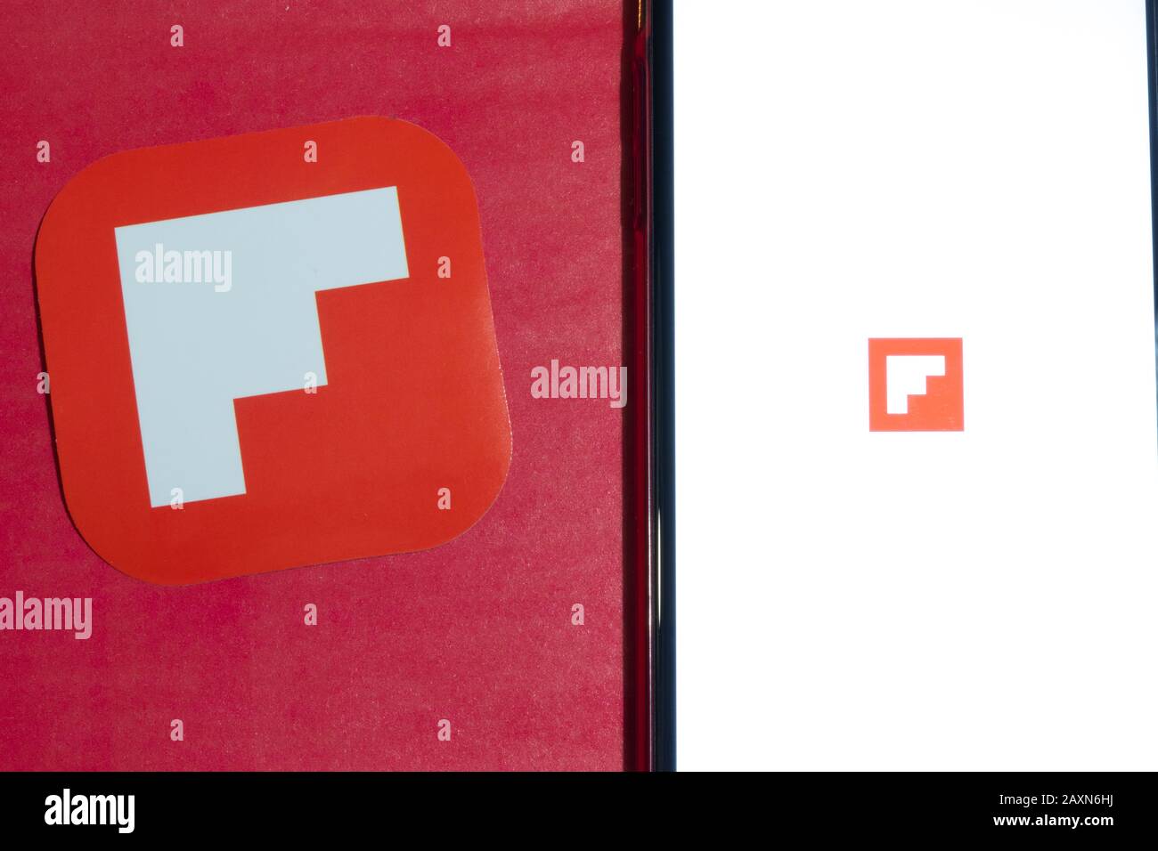 Los Angeles, California, USA - 12 February 2020: Flipboard app logo and phone with icon close up , Illustrative Editorial Stock Photo
