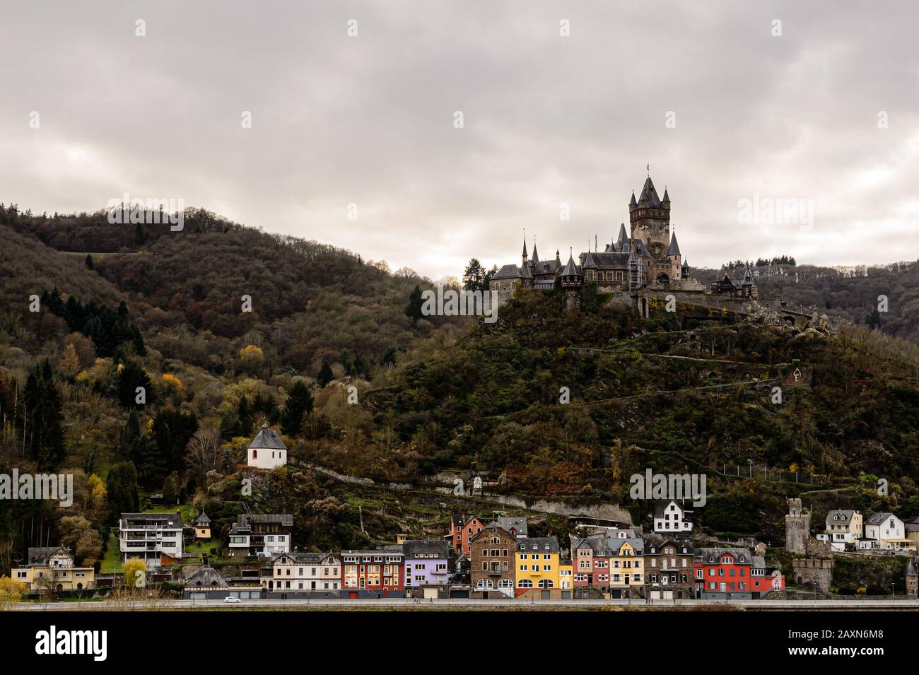 'Reichsburg' castle in autumn at dusk, Cochem, Germany Stock Photo