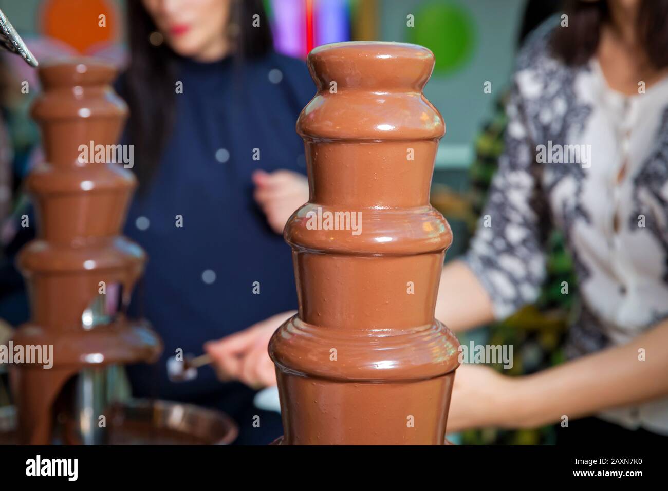 Chocolate fountain with fruits. Children birthday party . Homemade chocolate fountain fondue