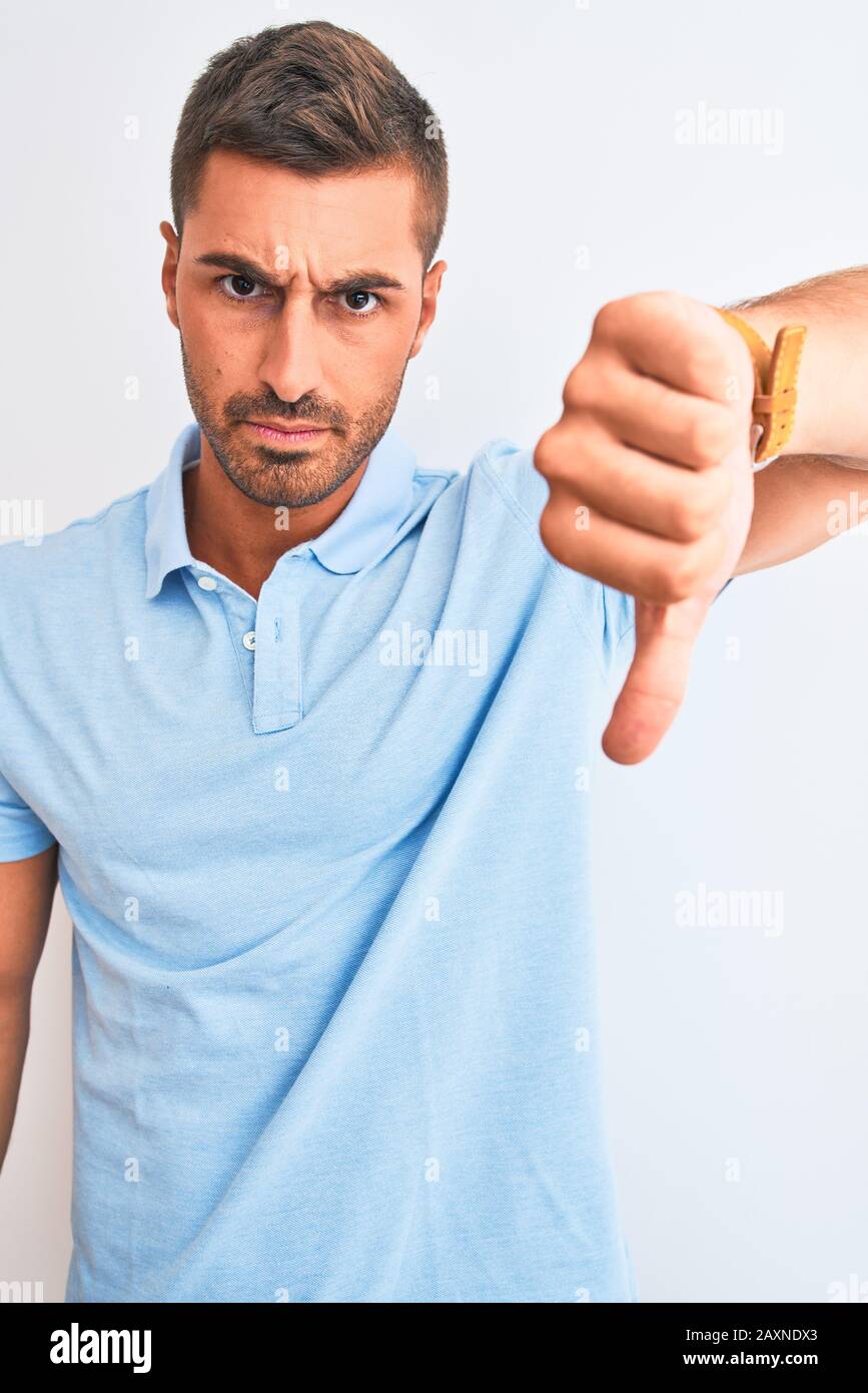Young handsome elegant man wearing blue t-shirt over isolated ...