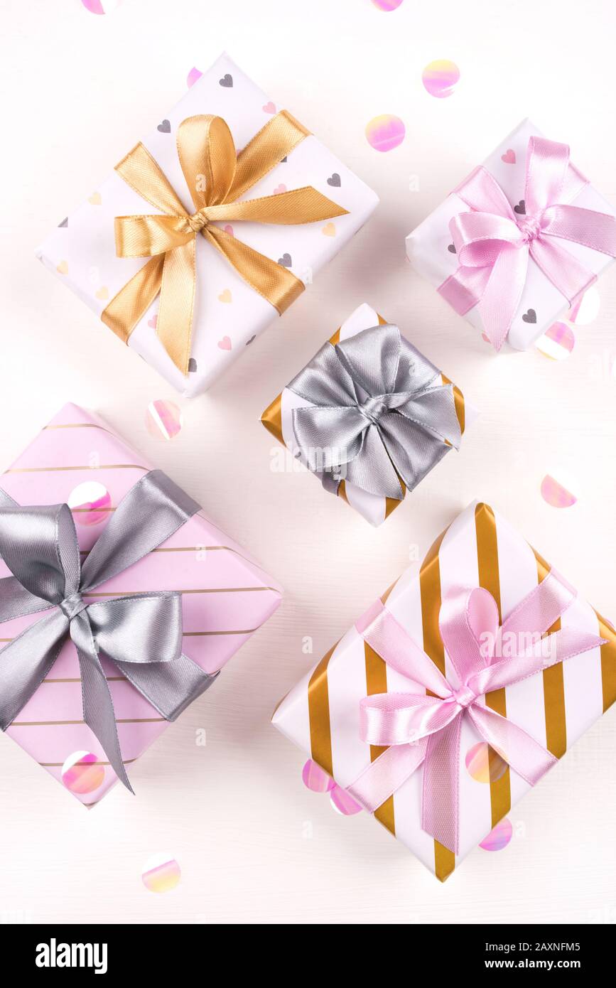 Set of gift boxes with bows and confetti on a white background Stock ...