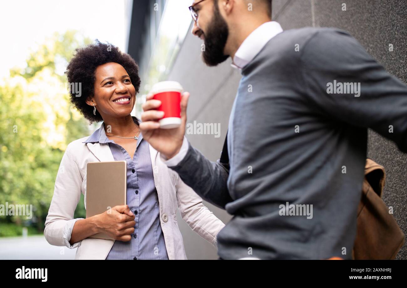 Happy business people, students having fun, smiling, talking in the ...