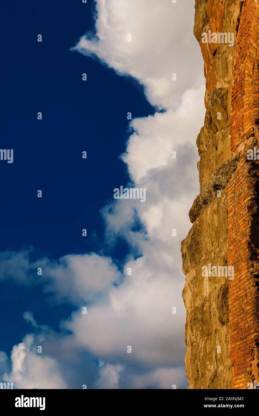 Ancient roman wall with clouds as background (with copy space) Stock Photo