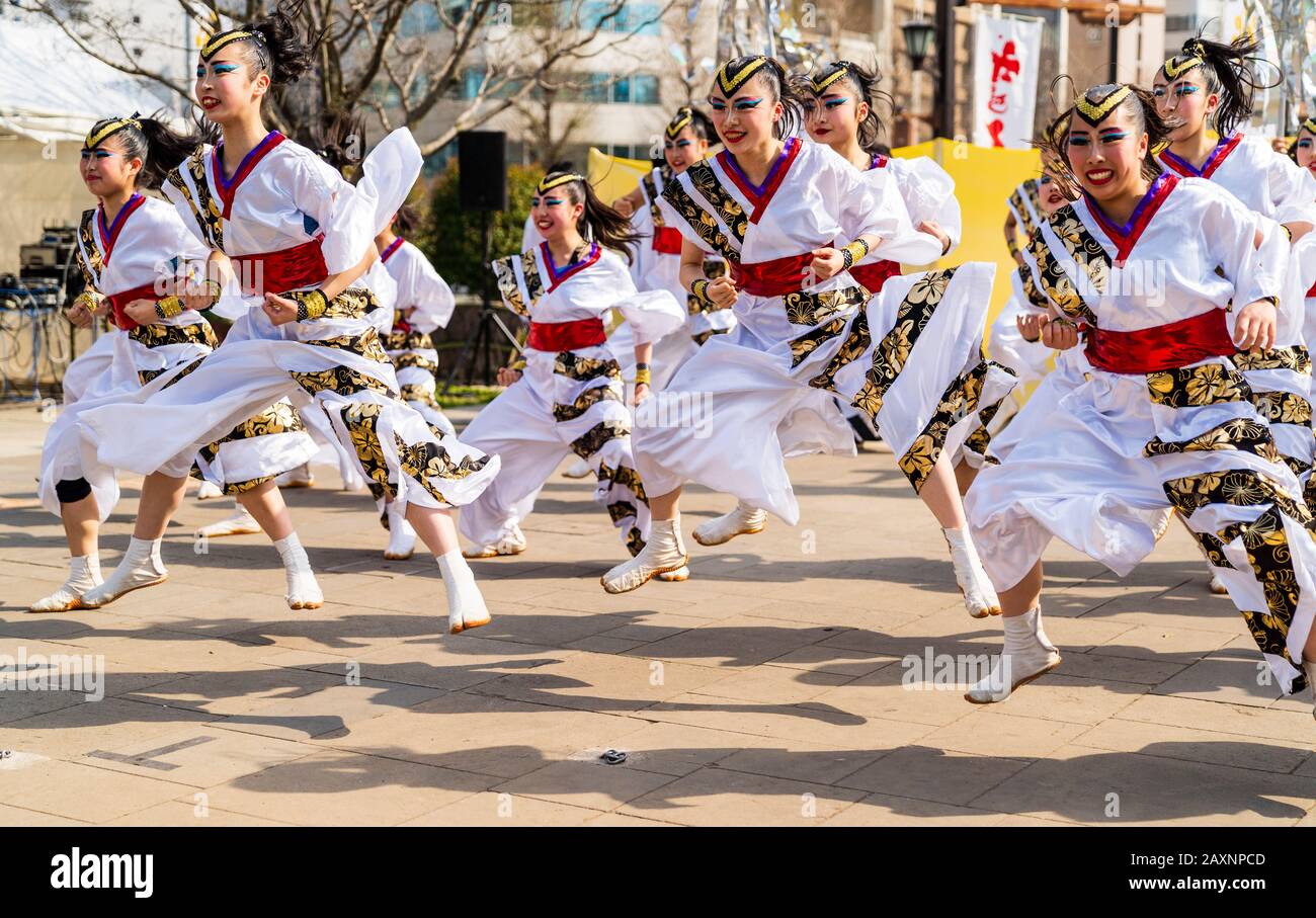 Japanese Yosakoi dance group dancing in public square at the Kyusyu