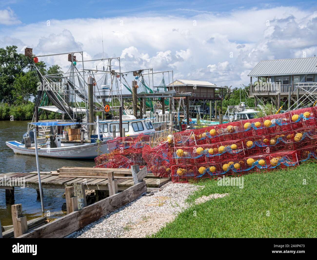 Coastal Fishing Boats and Crab Traps on the Bayou in Southern Louisiana Stock Photo