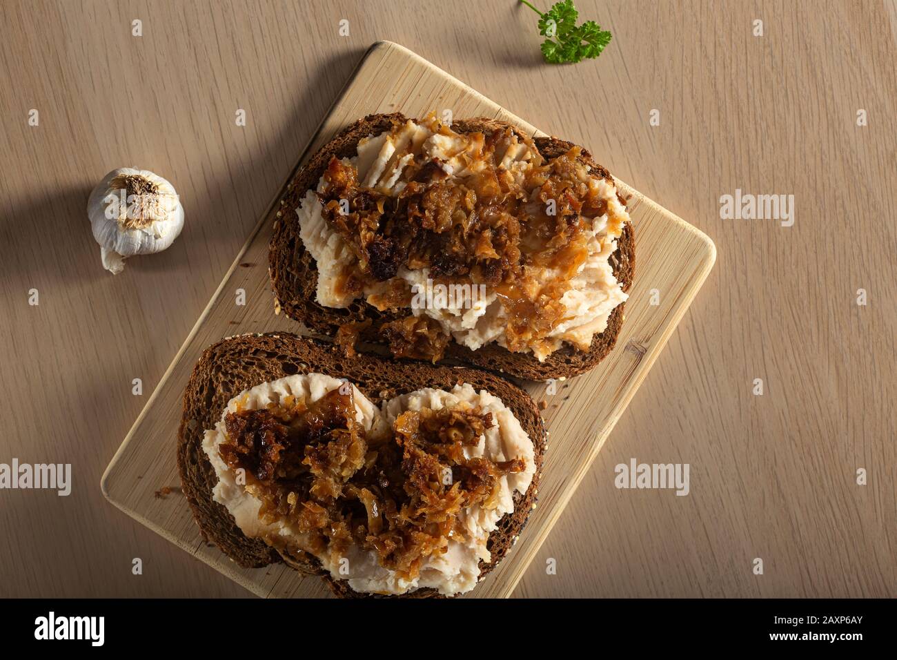 Iahnie - Romanian traditional food made from mashed beans and fried onion - top view Stock Photo