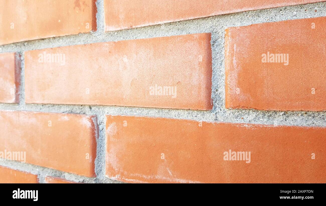 Orange brick wall. Close up perspective view. Stock Photo