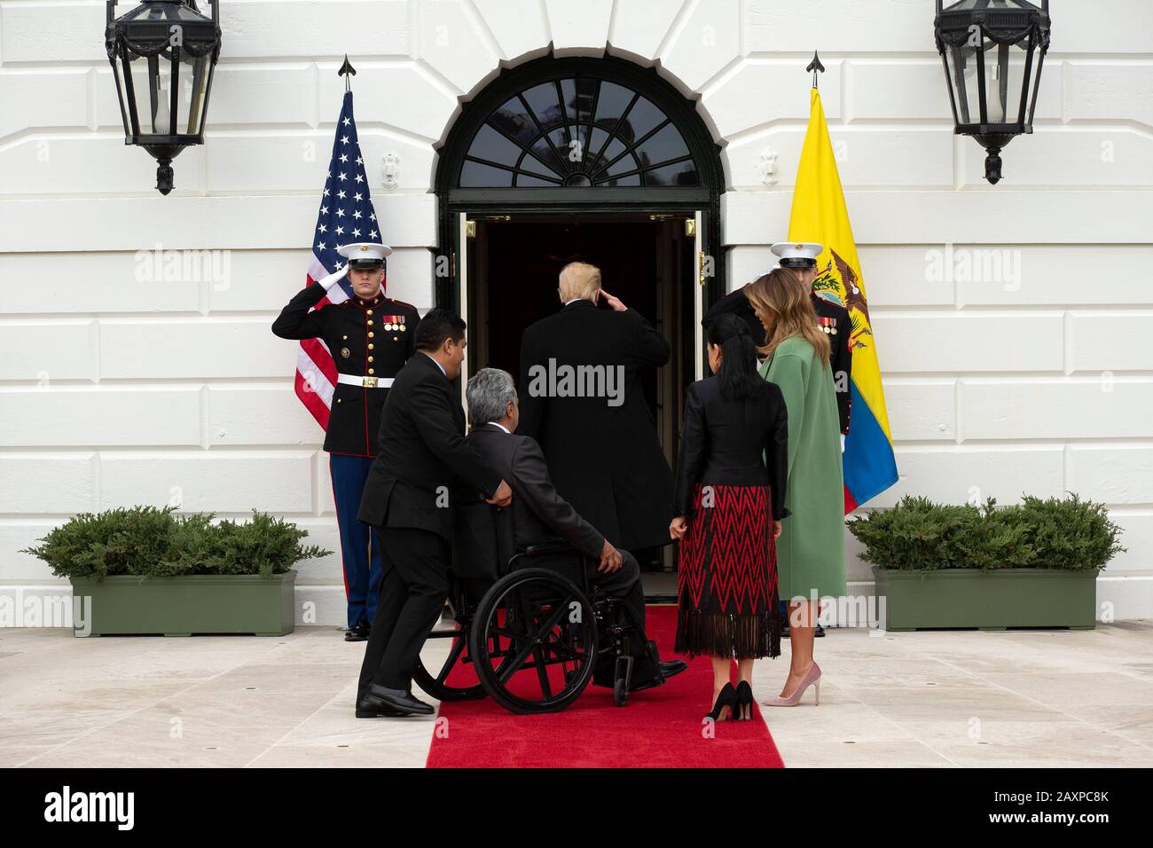 United States President Donald J. Trump salutes as he enters the White House with First lady Melania Trump, President of Ecuador Lenín Moreno, and his wife Rocio Gonzales De Moreno in Washington D.C., U.S. on Wednesday, February 12, 2020.   Credit: Stefani Reynolds / CNP /MediaPunch Stock Photo