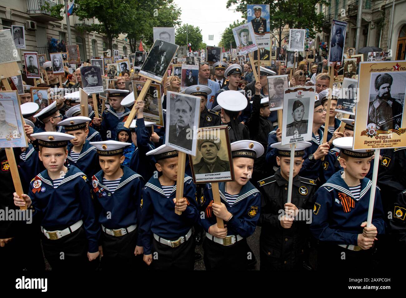 Sevastopol, Crimea, 9th of May, 2019 Cadets of the Nakhimov Naval School hold portraits with photography participants of the Great Patriotic War during the action the Immortal Regiment in Sevastopol city Stock Photo