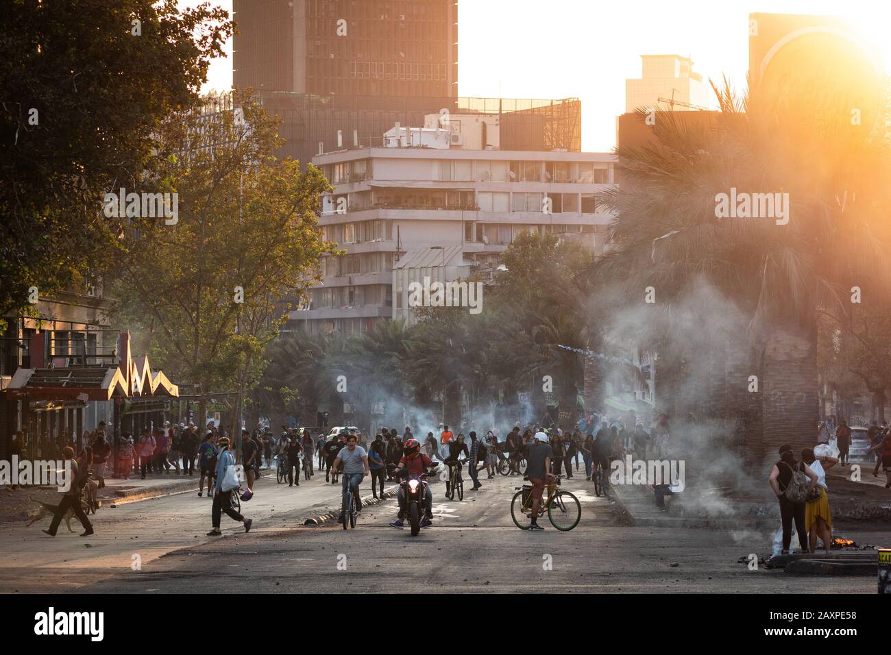 Protesters on the streets around Plaza de Italia during recent demonstrations in Santiago, Chile. Stock Photo