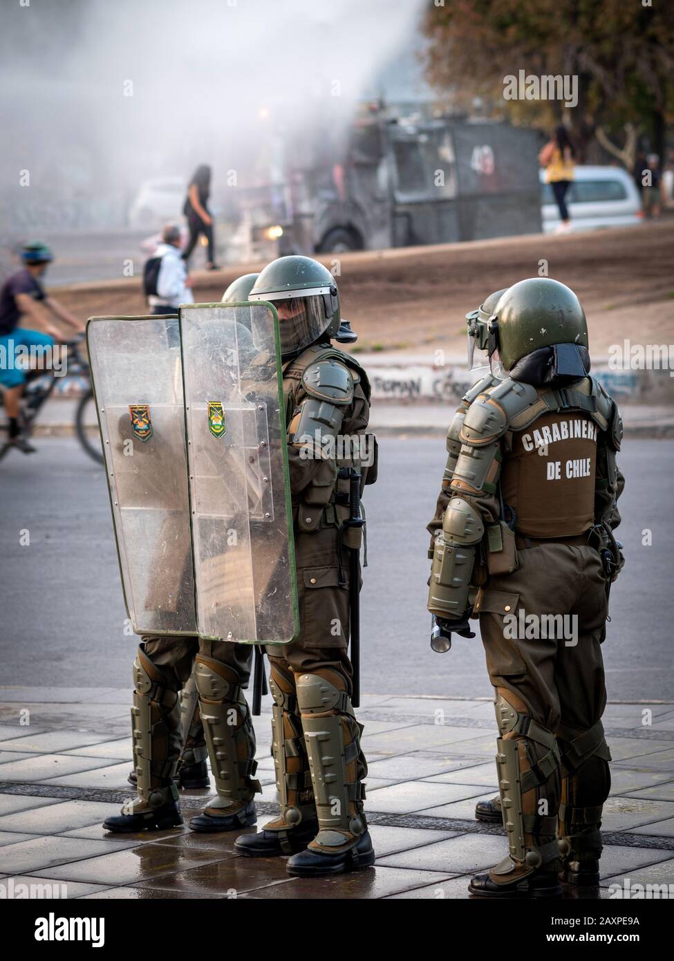 Riot police at Plaza de Italia in Santiago, Chile. The army is out on the city streets trying to control the recent protests and demonstrations. Stock Photo